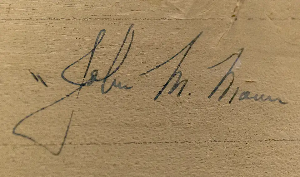 Unterschrift auf dem handgemalten Schild